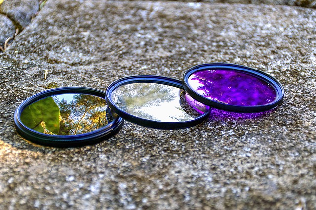 Three Coloured Lense Filters On A Rock