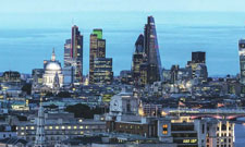 London skyline at night with towers lit up