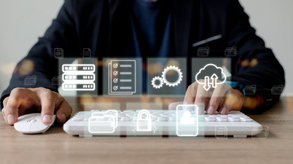 user controlling a white keyboard and mouse with 4 system integration icons ghosted above