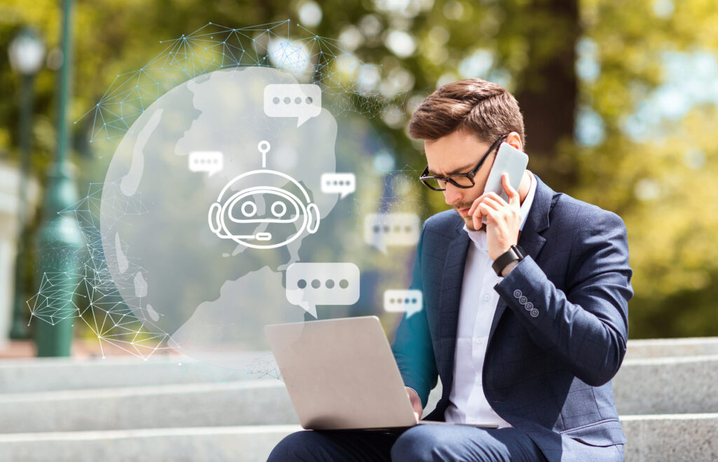 man sat outside looking at a laptop with images popping from the screen of AI agent development